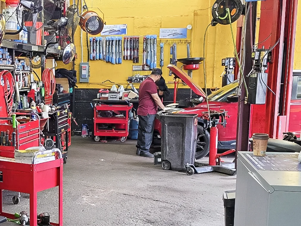 Mechanic diagnosing a vehicle inside Ebenezer Auto Repair
